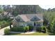 Charming home with a manicured front yard, inviting porch and brick and siding accents at 181 Colonial Ridge Dr, Pittsboro, NC 27312