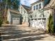 Wide shot of the side of the house showing multiple garages at 181 Colonial Ridge Dr, Pittsboro, NC 27312