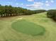 A green and sand traps on this green golf course at 181 Colonial Ridge Dr, Pittsboro, NC 27312
