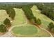 Scenic aerial view of a golf course with a lush green landscape and surrounding trees at 181 Colonial Ridge Dr, Pittsboro, NC 27312
