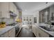 Bright kitchen with granite countertops, stainless steel appliances, and breakfast nook with natural lighting at 181 Colonial Ridge Dr, Pittsboro, NC 27312
