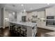 Gourmet kitchen with a large granite island, stainless steel appliances, and custom cabinetry at 181 Colonial Ridge Dr, Pittsboro, NC 27312