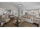 Bright and airy open-concept living space flowing into a modern kitchen with granite countertops at 181 Colonial Ridge Dr, Pittsboro, NC 27312