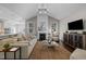 Spacious living room with high ceilings, a fireplace, and a seamless transition to the kitchen at 181 Colonial Ridge Dr, Pittsboro, NC 27312