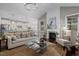 Bright open concept living space showcases a stylish fireplace and seamless flow to the modern kitchen at 181 Colonial Ridge Dr, Pittsboro, NC 27312