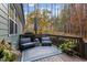Inviting outdoor deck with cozy seating area, perfect for enjoying the surrounding nature views at 181 Colonial Ridge Dr, Pittsboro, NC 27312