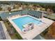 Community pool with slides, diving board, chairs and lush landscaping at 181 Colonial Ridge Dr, Pittsboro, NC 27312