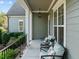Inviting covered porch featuring comfortable seating and stylish decor, perfect for relaxing outdoors at 181 Colonial Ridge Dr, Pittsboro, NC 27312