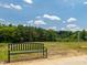 Community bench and adjacent community park and green space at 579 Winding Creek Dr, Lillington, NC 27546