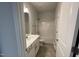 Clean bathroom featuring a vanity with storage and a shower-tub combination at 60 Falls Of The Cape Dr, Lillington, NC 27546