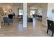 Open-concept living room with fireplace, neutral tones, and lots of natural light at 60 Falls Of The Cape Dr, Lillington, NC 27546