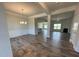 Spacious living area with hardwood flooring, high ceilings, and great flow into the kitchen at 60 Falls Of The Cape Dr, Lillington, NC 27546