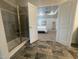Bathroom doorway view into the main bedroom, with shower on left, carpet, and tray ceilings at 60 Falls Of The Cape Dr, Lillington, NC 27546