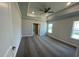 Spacious main bedroom featuring a tray ceiling, recessed lighting, and neutral carpeting at 60 Falls Of The Cape Dr, Lillington, NC 27546
