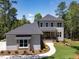 Charming two-story home with neutral siding and mature landscaping and walkway at 103 Brandy Ml, Pittsboro, NC 27312