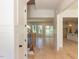 Spacious living room with hardwood floors and large windows leading into the kitchen at 103 Brandy Ml, Pittsboro, NC 27312