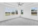 Bright bedroom with gray carpet and large windows at 444 Billingshurst Way, Knightdale, NC 27545