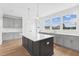 Open concept kitchen with large island and stainless steel appliances at 444 Billingshurst Way, Knightdale, NC 27545