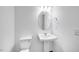 Neutral bathroom with pedestal sink and toilet for a clean and efficient design at 657 Sun Meadow Dr, Wake Forest, NC 27587