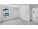 Bright bedroom with plush carpeting, a window view, and a double-door closet for ample storage at 657 Sun Meadow Dr, Wake Forest, NC 27587