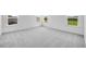 The bedroom offers neutral carpeting, a double window for natural light, and ample closet space at 657 Sun Meadow Dr, Wake Forest, NC 27587