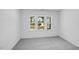 The bedroom offers neutral carpeting, a double window for natural light, and ample closet space at 657 Sun Meadow Dr, Wake Forest, NC 27587