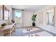 Bright bonus room with neutral decor, large windows offering natural light, and mirrors for fitness/recreation at 657 Sun Meadow Dr, Wake Forest, NC 27587