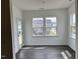 Bright dining area with hardwood floors, lots of natural light, and a door leading outside at 657 Sun Meadow Dr, Wake Forest, NC 27587
