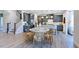 Open-concept kitchen with gray cabinets, stainless steel appliances, and a dining area at 657 Sun Meadow Dr, Wake Forest, NC 27587