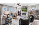Cozy living room features a fireplace, large windows, and natural light at 905 Delano Dr, Knightdale, NC 27545