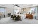 A serene main bedroom featuring elegant wallpaper and large windows providing ample natural light at 905 Delano Dr, Knightdale, NC 27545