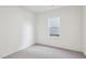 Simple bedroom with neutral wall and gray carpet at 276 Babbling Brook Dr, Clayton, NC 27520