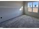 Simple bedroom with a window and concrete flooring at 32 Tanseyleaf Dr, Smithfield, NC 27577