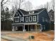 Two-story navy blue house with a front porch and a two-car garage at 3267 Roundly Rd # 8, New Hill, NC 27562