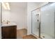 Bright bathroom with a glass-enclosed shower, marble vanity, and neutral flooring at 3408 Cross Timber Ln, Raleigh, NC 27603
