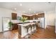 Bright kitchen featuring a kitchen island with barstool seating and stainless steel appliances at 3408 Cross Timber Ln, Raleigh, NC 27603