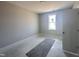 Neutral bedroom with a large window allowing for plenty of natural light at 102 Ruskin Dr, Smithfield, NC 27577