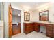 Bathroom features marble countertops, wood cabinets, and access to the bedroom at 106 Springbrook Pl, Cary, NC 27518