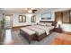 Bedroom features natural light, a ceiling fan, wood trim, and a rug in the center of the room at 106 Springbrook Pl, Cary, NC 27518