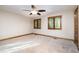 Neutral bedroom featuring carpet, ceiling fan, and windows with wooden blinds at 106 Springbrook Pl, Cary, NC 27518