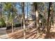 Secluded home exterior surrounded by mature trees offering privacy and curb appeal at 106 Springbrook Pl, Cary, NC 27518