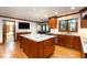 Bright kitchen featuring modern appliances, granite countertops, and custom cabinetry at 106 Springbrook Pl, Cary, NC 27518