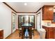 Sunny kitchen area with table, chairs, and a view of the back yard at 106 Springbrook Pl, Cary, NC 27518