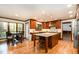 Spacious kitchen with custom cabinets, granite countertops, and a center island at 106 Springbrook Pl, Cary, NC 27518