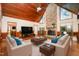 Spacious living room with vaulted ceilings, stone fireplace, and plenty of natural light at 106 Springbrook Pl, Cary, NC 27518