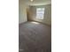 Bright bedroom with carpet and a large window, perfect for relaxation and comfort at 1103 Mountain Crown St, Durham, NC 27703