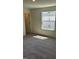 Comfortable bedroom with plush carpet, a window, and easy access to closet and additional space at 1103 Mountain Crown St, Durham, NC 27703