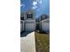 Charming townhome showcasing a well-manicured lawn and attached one car garage at 1103 Mountain Crown St, Durham, NC 27703
