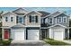 New townhomes offer modern exteriors with garages and varied color schemes at 1103 Mountain Crown St, Durham, NC 27703