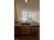Modern kitchen featuring granite countertops, stainless steel appliances, and open floor plan at 1103 Mountain Crown St, Durham, NC 27703